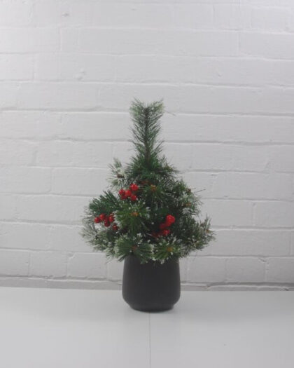 artificial Christmas tree with red berries