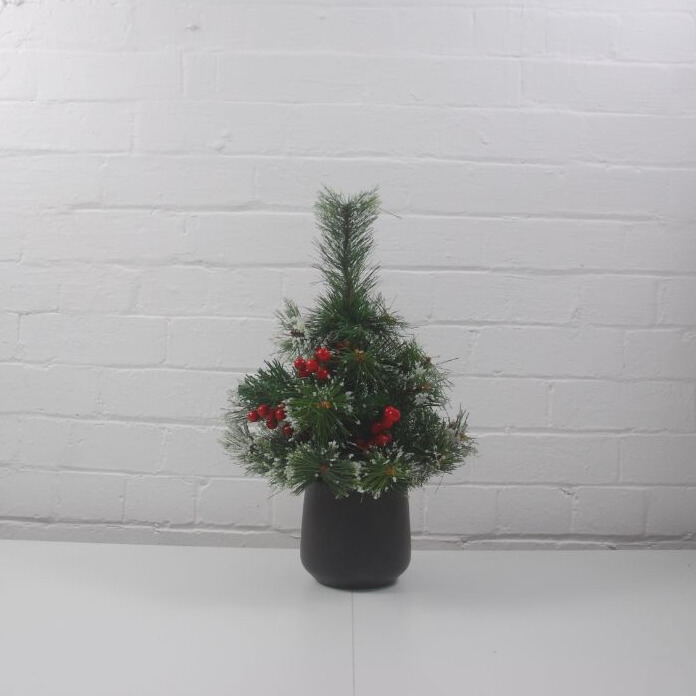 artificial Christmas tree with red berries